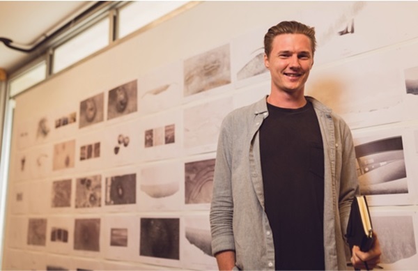 architecture student with drawings