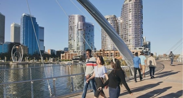 People walking on the Elizabeth Quay bridge