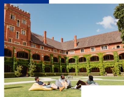 Students sitting in front of accomodation building